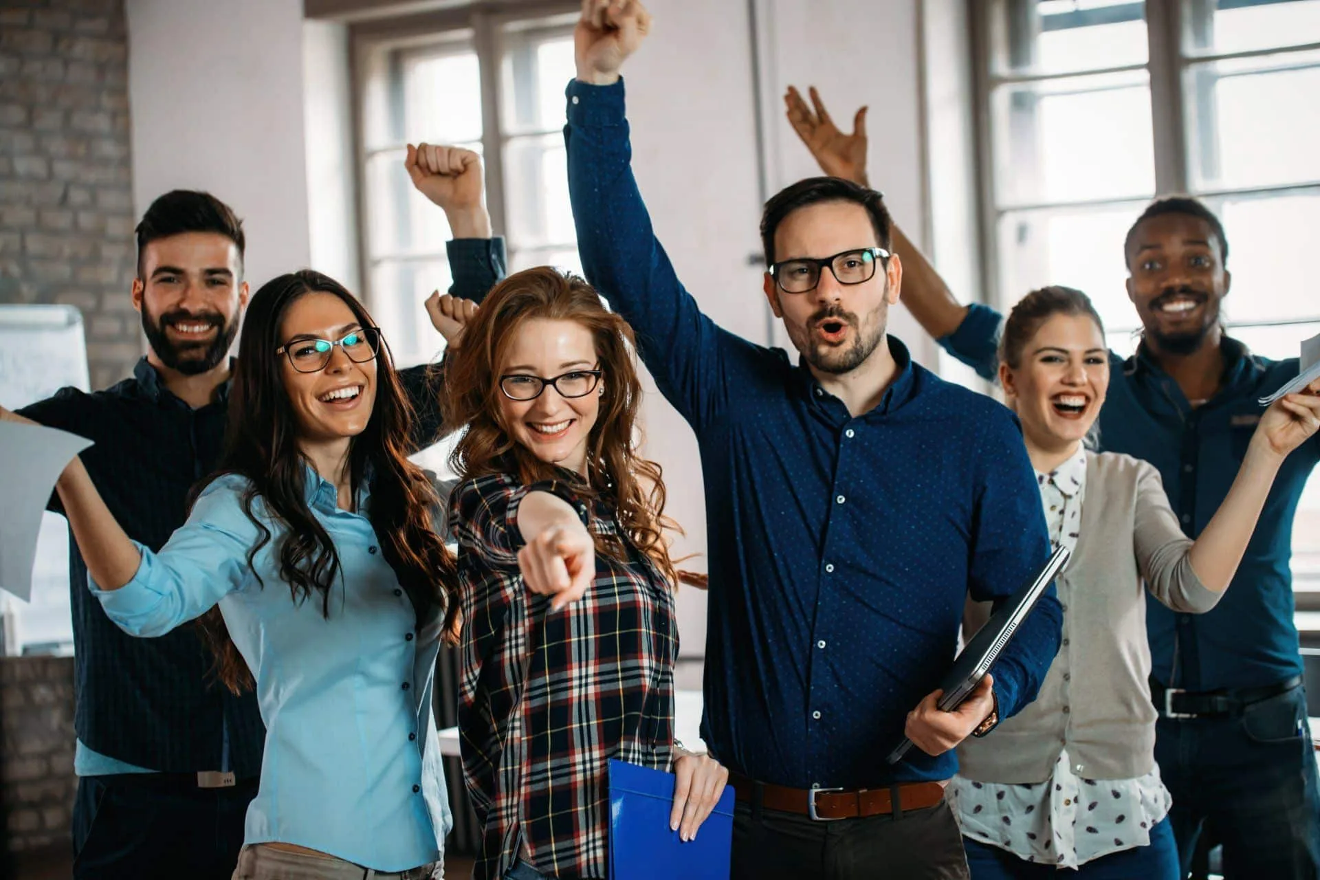 Why Your Office Needs a Commercial Cleaning Service 16 a picture of happy office staff
