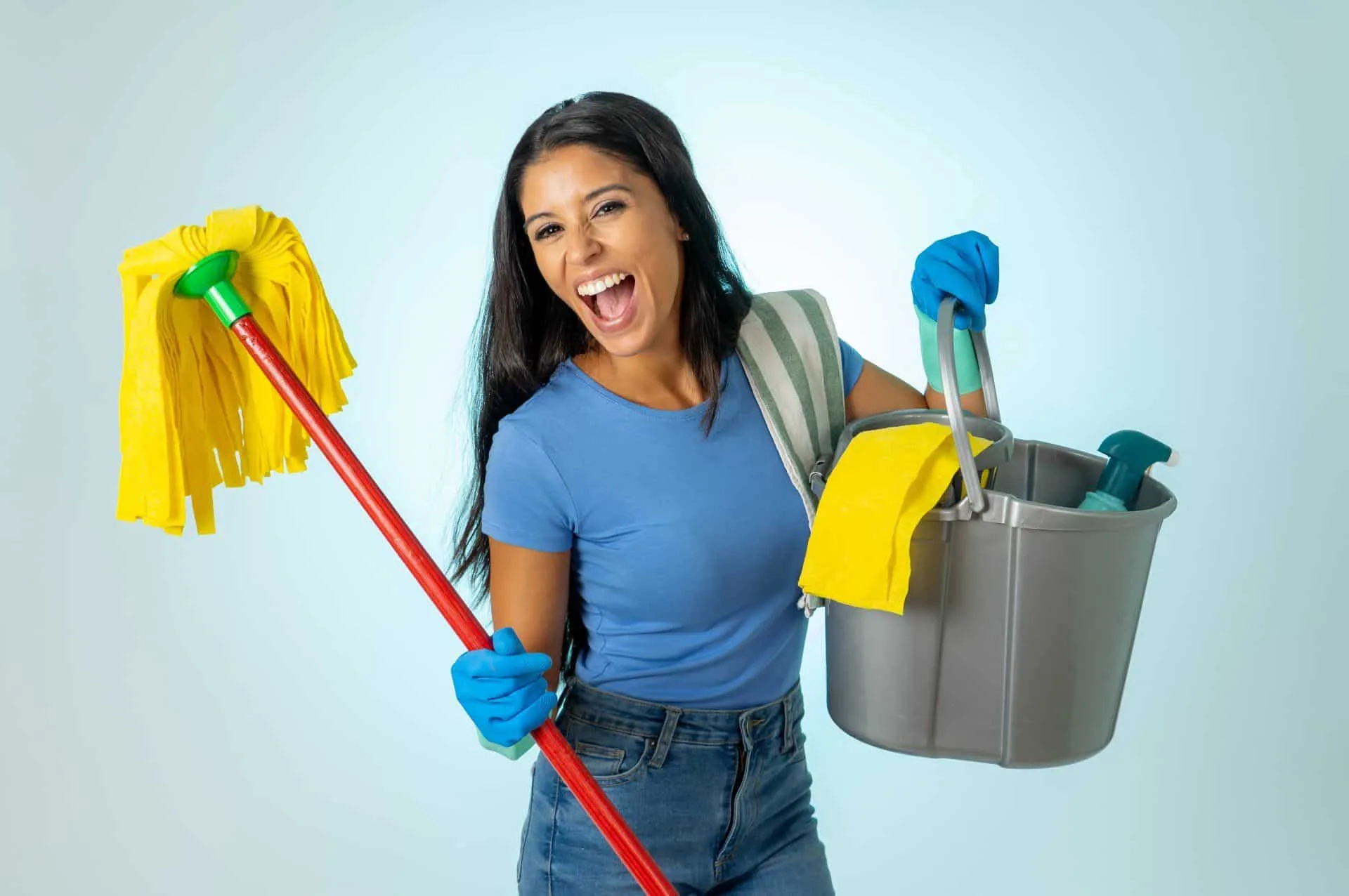 How to Clean Your House Using Bleach 7 woman enthusiastically holding a mop and cleaning supplies
