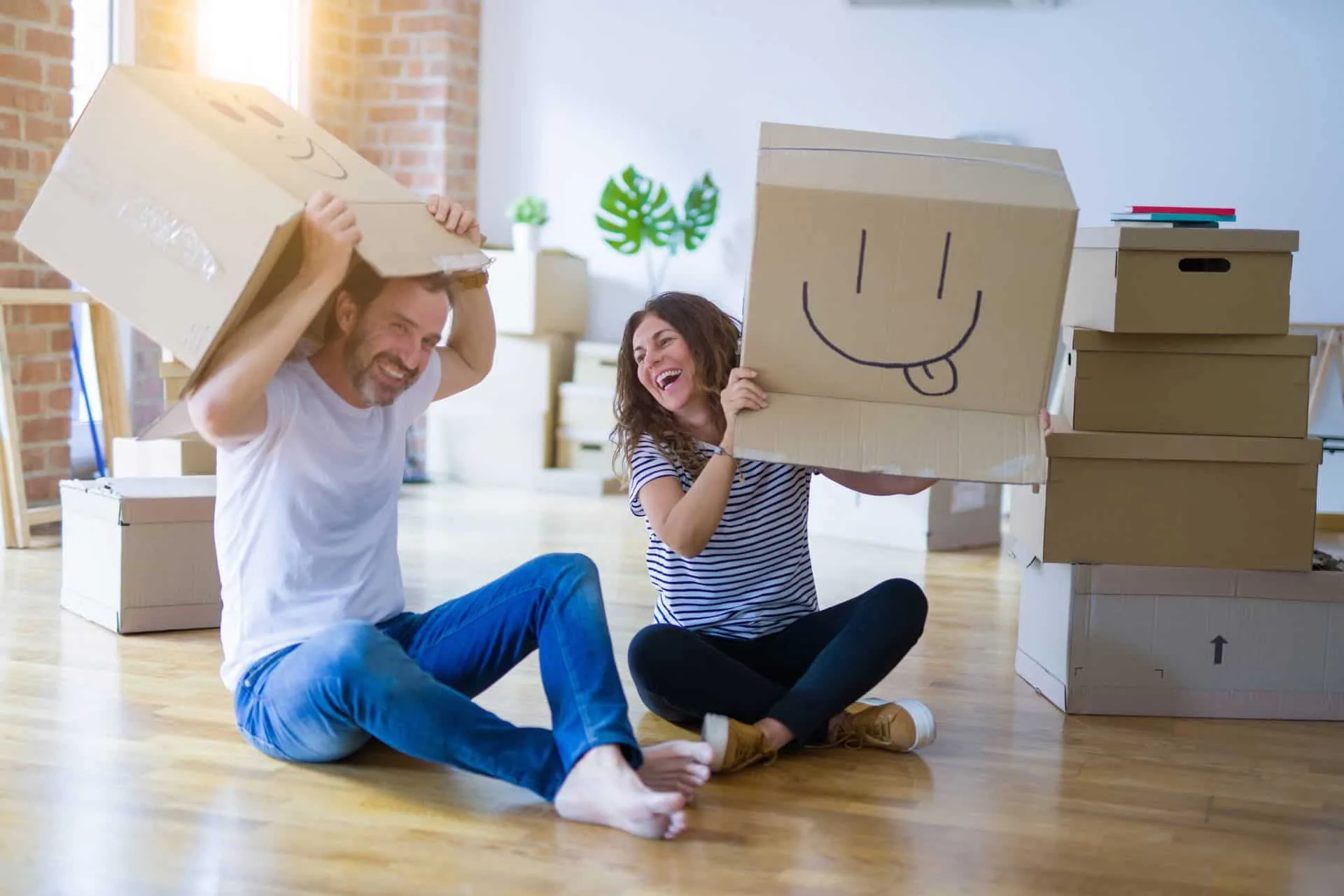 Your Move Out Cleaning Checklist 7 coupe removing smile face boxes from their heads and laughing