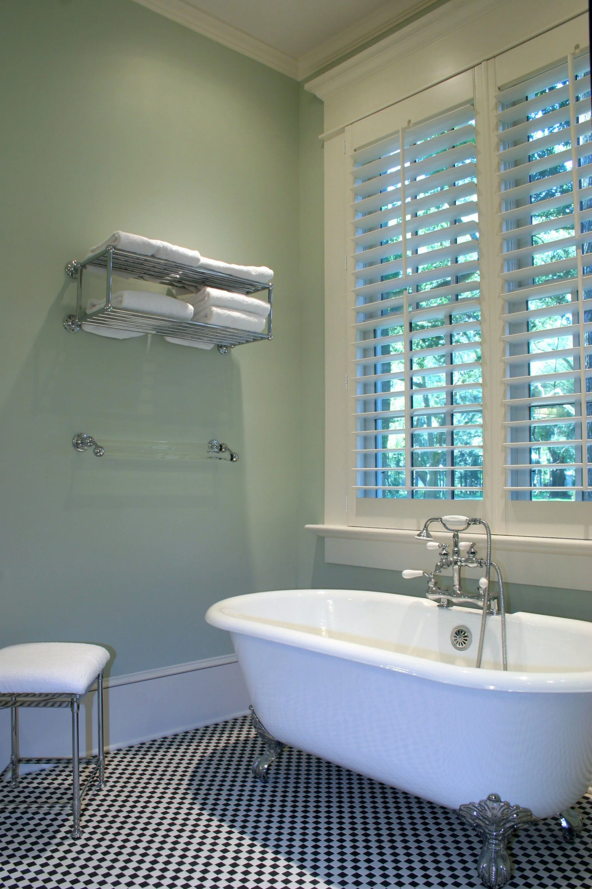 There is a Right Way to Scrub-A-Dub Your Tub 5 A clean bathtub in a soft green bathroom