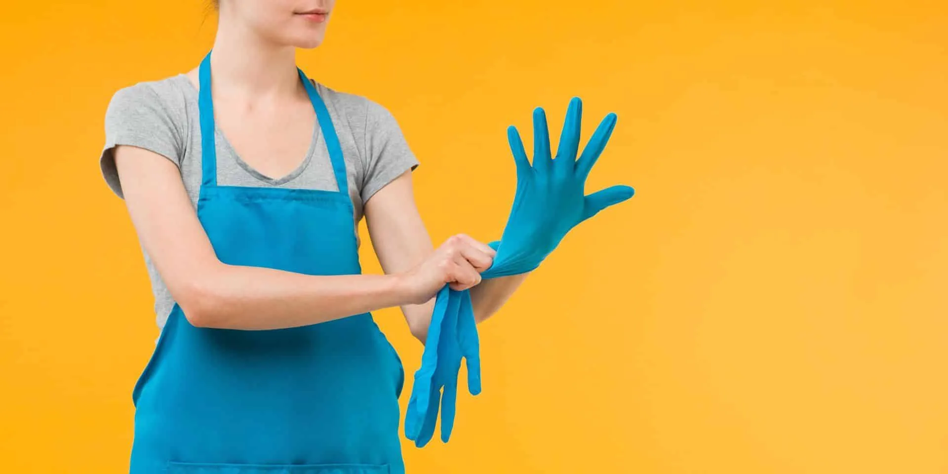 How to Have the Best Smelling House on the Block 48 woman putting blue cleaning glove on her hand