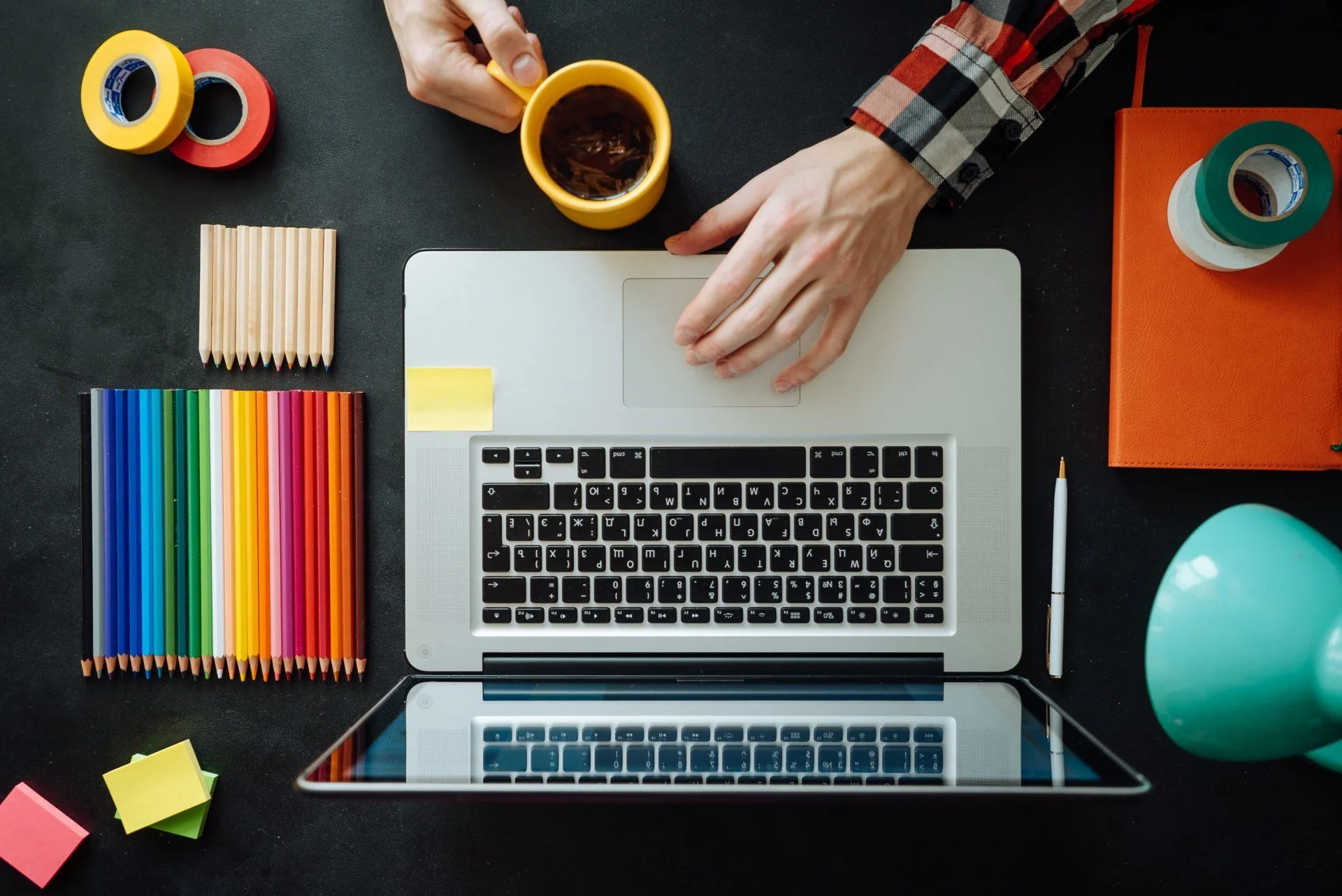 9 Things You Can Clean While Working Remotely 30 a man working remotely at a very organized desk