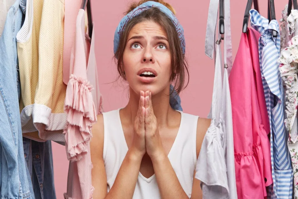5 Hall Closet Organization Tips 2 a woman praying in her hall closet
