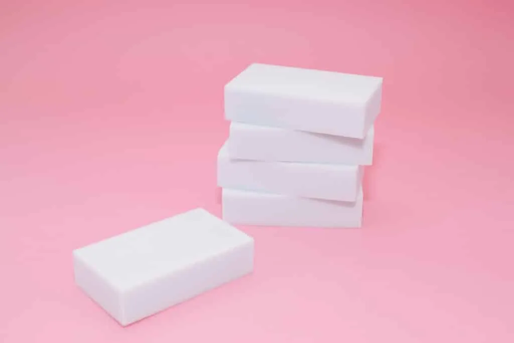 How to Clean Baseboards 10 A stack of Magic Erasers on a pink background