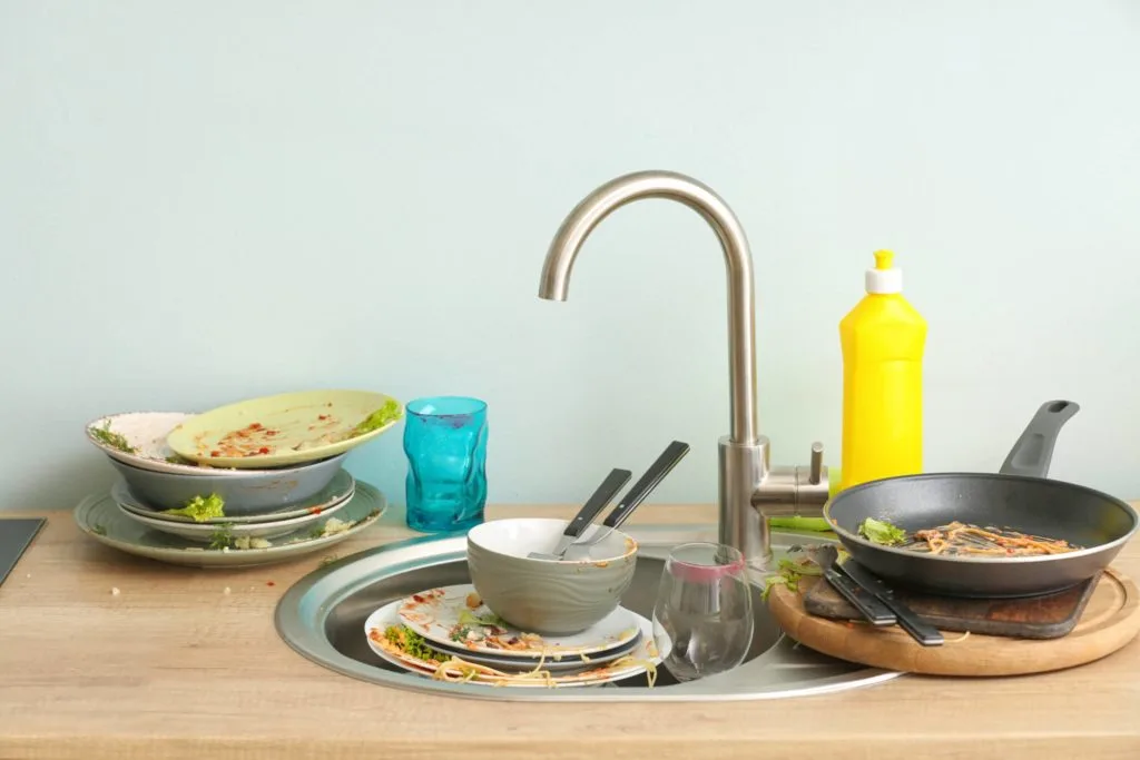 Pesky Pests: Learn How to Get Rid of Fruit Flies For Good 8 A sink full of dirty dishes. How do you get rid of fruit flies? Clean up troublesome food mess.