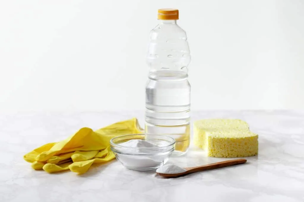 How to Get Nail Polish Out of Carpet 5 Vinegar and baking soda with a sponge and yellow, rubber cleaning gloves.