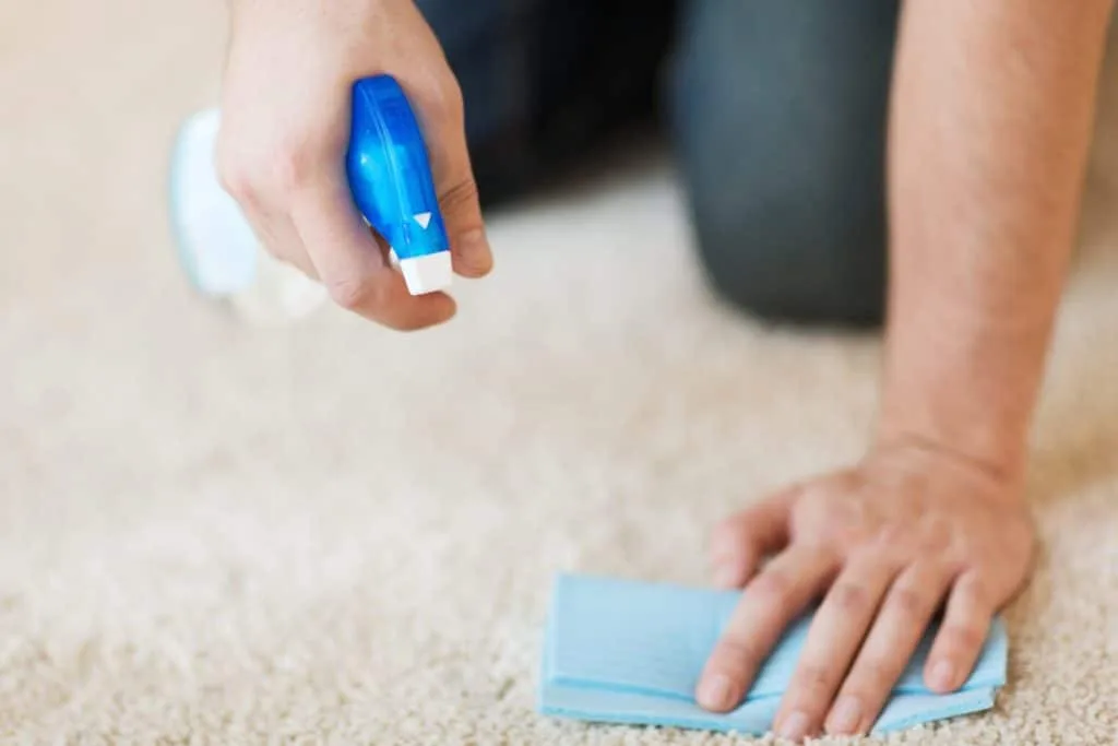 How to Get Nail Polish Out of Carpet 4 A man doing a patch test on his carpet when figuring out how to get nail polish out of carpet