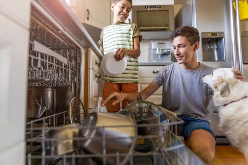 These 7 Chores for Kids Let You Delegate the Housework 1 Kids emptying the dishwasher. Emptying the dishwasher is a good chores for kids.